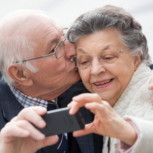 Older Couple Taking A Selfie